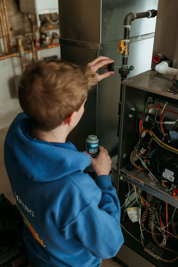 Plumber repairing pipe