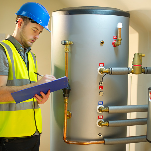 Technician repairing gas furnace