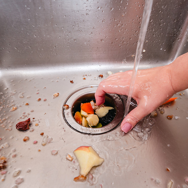 Food waste disposal in a sink garbage disposal unit