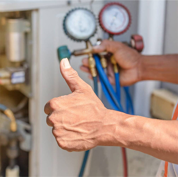 Technician checking furnace temperature