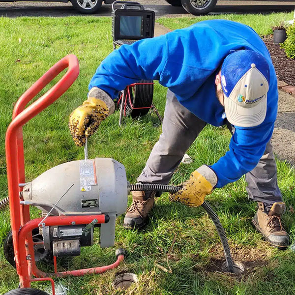 Worker cleaning drain in Michigan City