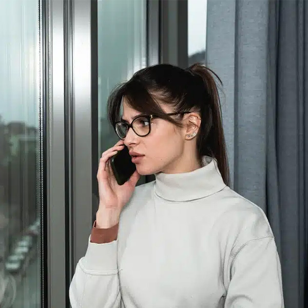 Woman talking on the phone with plumber